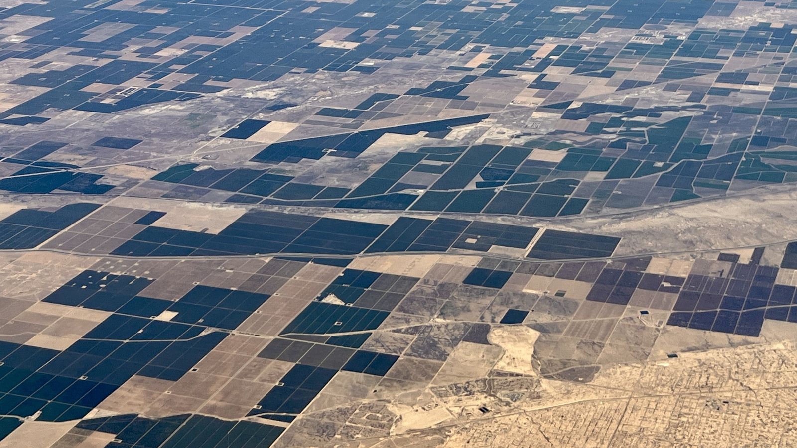 A patchwork of cultivated blocks from the air, divided by service roads